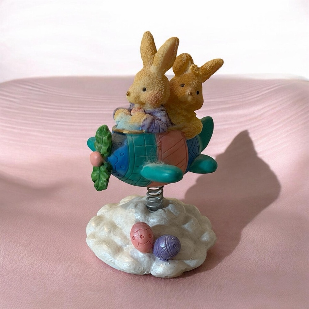 Easter Figurine with Bunnies on a Plane